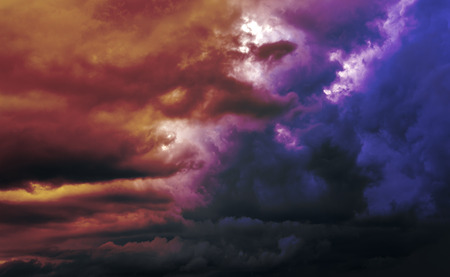 Colorful clouds and sun on the sky. Color toned image.