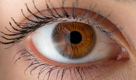 Human eye with reflection. Macro shot with shallow depth of field.の写真素材