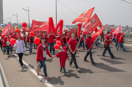 VLADIVOSTOK, RUSSIA - MAY 1, 2015: Citizens and representatives of various organizations take part in May day parade to celebrate the international Workers\' Day.のeditorial素材
