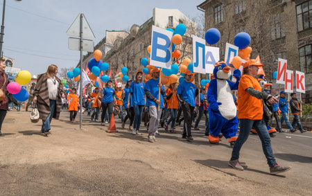 VLADIVOSTOK, RUSSIA - MAY 1, 2015: Citizens and representatives of various organizations take part in May day parade to celebrate the international Workers\' Day.のeditorial素材