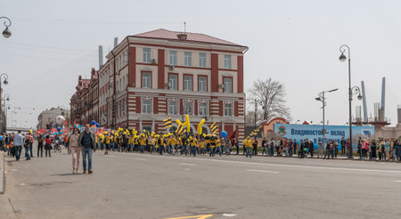 VLADIVOSTOK, RUSSIA - MAY 1, 2015: Citizens and representatives of various organizations take part in May day parade to celebrate the international Workers\' Day.のeditorial素材