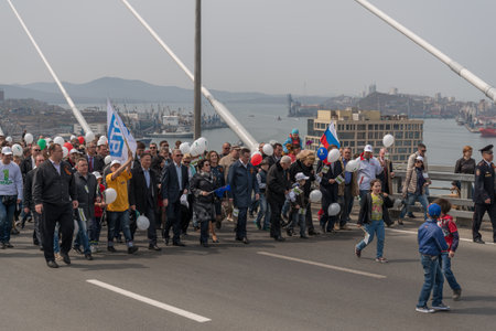 VLADIVOSTOK, RUSSIA - MAY 1, 2015: Citizens and representatives of various organizations take part in May day parade to celebrate the international Workers\' Day.のeditorial素材