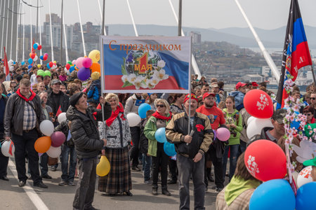 VLADIVOSTOK, RUSSIA - MAY 1, 2015: Citizens and representatives of various organizations take part in May day parade to celebrate the international Workers\' Day.のeditorial素材
