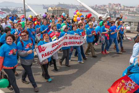 VLADIVOSTOK, RUSSIA - MAY 1, 2015: Citizens and representatives of various organizations take part in May day parade to celebrate the international Workers\' Day. International Workers\' Day is a celebration of labour and the working classes.のeditorial素材