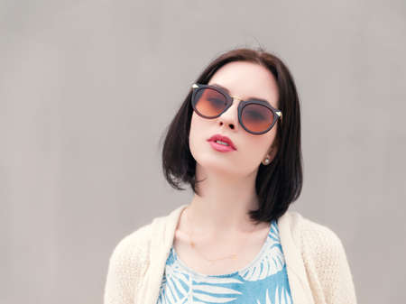Portrait of a beautiful young girl in a sunglasses.の写真素材