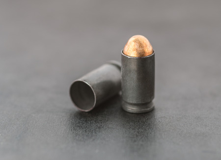 Two bullets on dark background.の写真素材