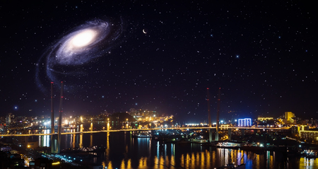 City landscape at night with sky with stars and galaxy.の写真素材