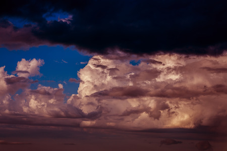Dramatic sunset sky with dark clouds.の写真素材