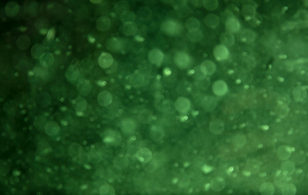 Abstract circular green bokeh background.