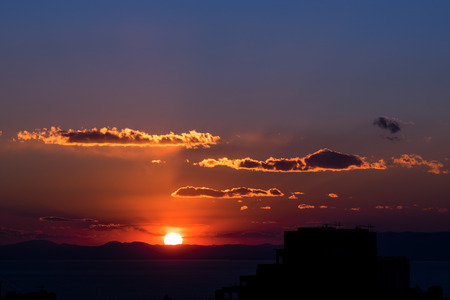 Sunset and silhouette of buildings.の写真素材