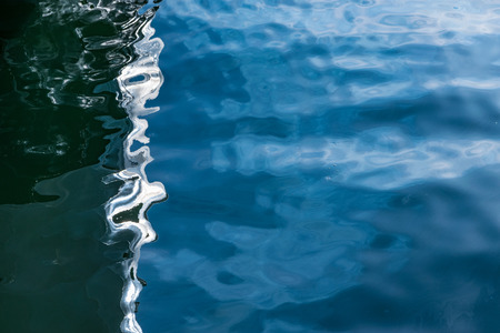 Blue sea surface with reflection.の写真素材
