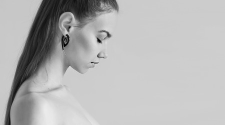 Black ans white portrait of a beautiful young woman.の写真素材
