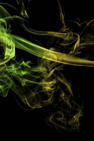 Green smoke on a black background.の写真素材