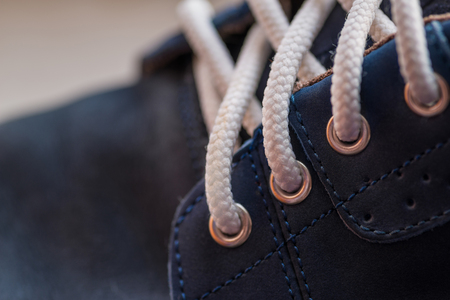 Leather (Nubuck) shoes, focus on details. Macro shot with shallow depth of field.
