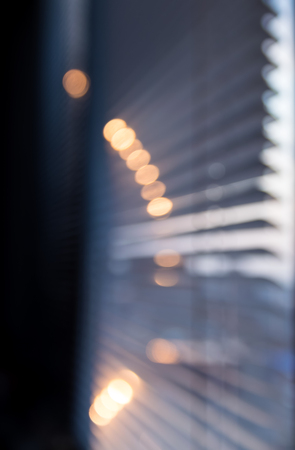 Sun shining through the blinds. Blured background.の写真素材