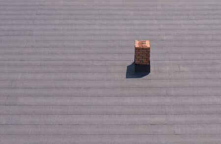 Roof with brick chimney.の写真素材