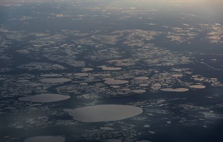 View from airplane on Earth surface - a group of small lakes.