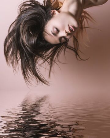 Portrait of a beautiful young brunette. Selective soft focus.の写真素材