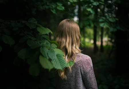 Outdoors portrait of young woman. Selective focus.の写真素材