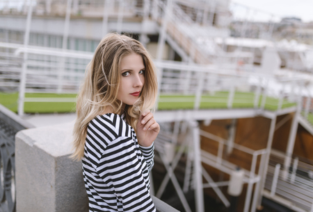 Outdoors portrait of beautiful young woman. Selective focus.の写真素材