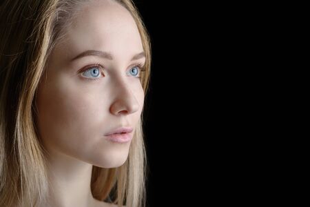 Portrait of a beautiful young woman with blue eyes.の写真素材