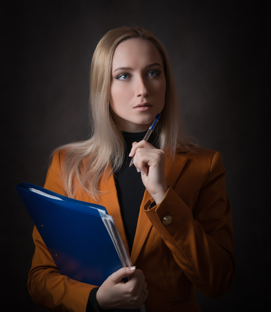 Business woman portrait on dark background.の写真素材