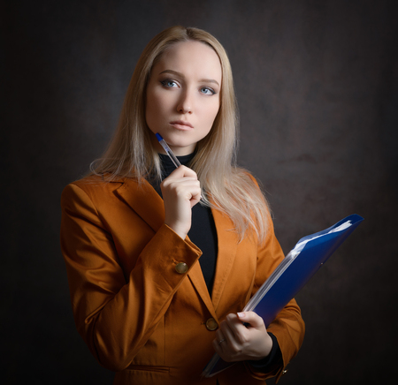 Business woman portrait on dark background.の写真素材