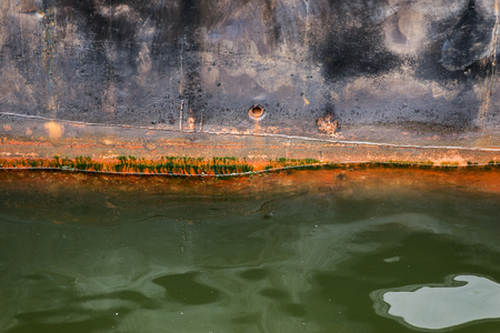 Moored rusted vessel. Selective focus.の写真素材