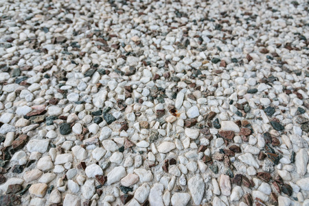 Wall with small stones as texture background.