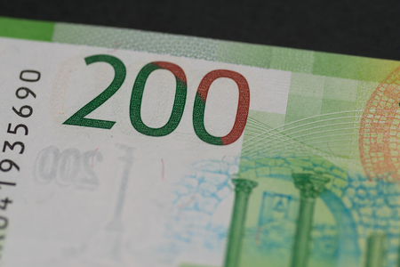 Banknote of new two hundred rubles, detail view. Macro with selective focus and shallow depth of...