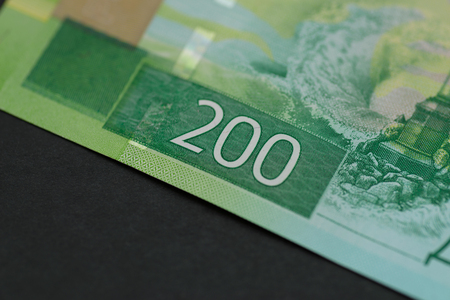 Banknote of new two hundred rubles, detail view. Macro with selective focus and shallow depth of field.の写真素材