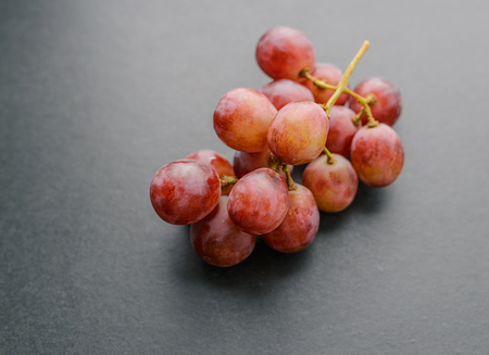 Grapes on dark background. Selective focus with shallow depth of field.の写真素材