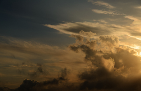 Dramatic sunset sky with dark clouds.の写真素材