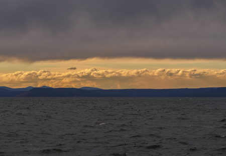 Beautiful sunset with clouds and sea.の写真素材