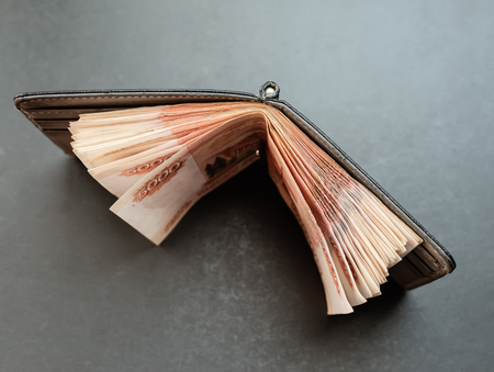 Five-thousandth banknotes in the wallet. Selective focus with shallow depth of field.の写真素材