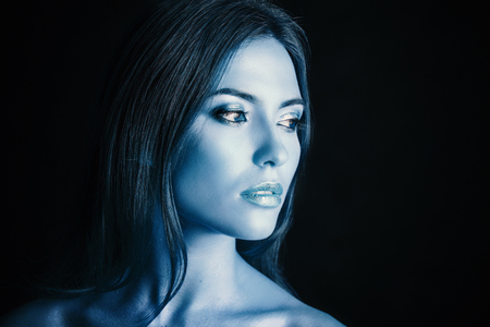 Portrait of a young woman model with blue make-up.の写真素材