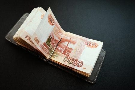 Five-thousandth banknotes in the wallet.
