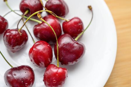 Cherry on the table in a cup. Selective focus.の写真素材