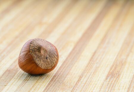 Hazelnuts on a wooden background. Selective focus with shallow depth of field.の写真素材