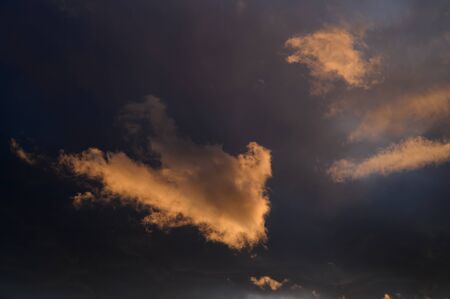 Dramatic sky with orange clouds. Nature background.の写真素材
