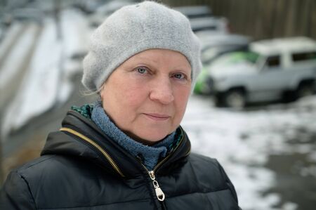 Winter portrait of a beautiful aged woman.の写真素材