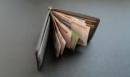 Russian money in the wallet on dark background.の写真素材