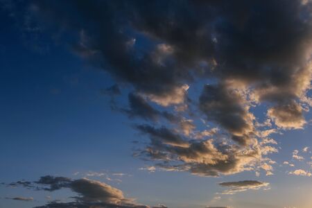 Blue sky with dark clouds. Nature background.の写真素材