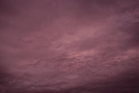 Dramatic sky with purple clouds. Nature background.の写真素材