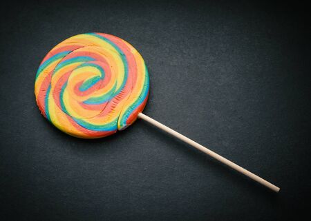 Natural looking lollipop on dark background.の写真素材