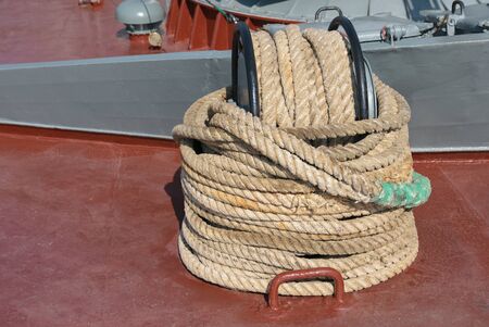 Rolled rope on the deck of a ship.の写真素材