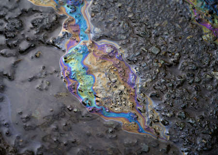 Gasoline flows on the pavement.の写真素材