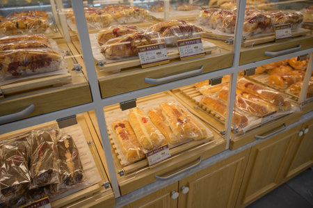 MISHAN, CHINA - JULY 28, 2019: Various baked products at chinese shop. Selective focus.のeditorial素材