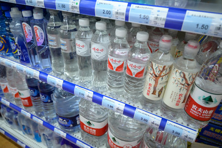 MISHAN, CHINA - JULY 28, 2019: Various drinks at chinese shop. Selective focus.のeditorial素材