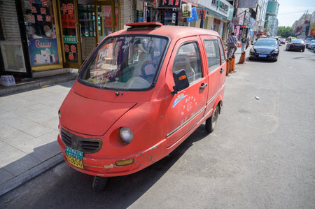 MISHAN, CHINA - JULY 27, 2019: Motorcycle-car (tricycle car) in the street of Mishan. Mishan is a county-level city in the southeast of Heilongjiang Province.のeditorial素材